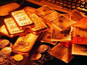 Bakgrundsbilder på skrivbordet Pengar Guld Sedlar Ett mynt