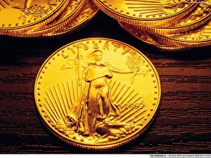 Bureaubladachtergronden Geld Munten Liberty gold coin. USA