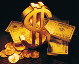 Bakgrundsbilder på skrivbordet Pengar Guld Ett mynt Sedlar