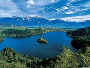 Bureaubladachtergronden Een meer Slovenië Hemelgewelf Berg Natuur