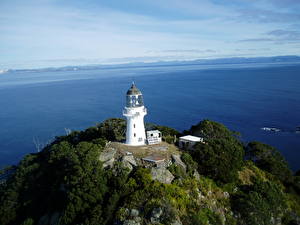 Bureaubladachtergronden De kust Vuurtoren Cuvier Island New Zealand Natuur