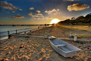Fotos Morgendämmerung und Sonnenuntergang Küste Boot Sonne Natur