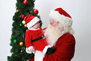 Fotos Feiertage Neujahr Baby Mütze Weihnachtsmann Barthaar Kinder