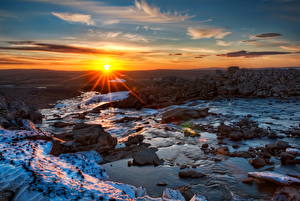 Фотография Рассветы и закаты Небо Камни Лучи света Облачно Солнце Природа