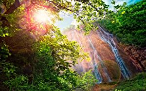 Wallpapers Waterfalls Rays of light Trees Leaf Branches Nature