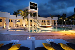 Фотография Курорты Доминиканская Республика Плавательный бассейн Кровать Подушки Ночные Пальма Дизайн город