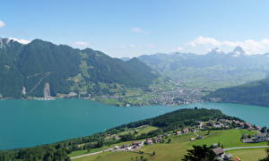 Tapety na pulpit Szwajcaria Góry Niebo Jezioro Widok z góry  miasto