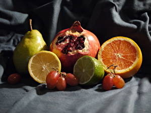 Картинка Натюрморт Цитрусовые Лимоны Гранат Апельсин Пища
