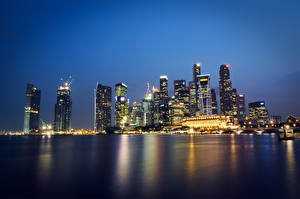 Bakgrundsbilder på skrivbordet Malaysia Singapore Skyskrapor Kusten På natten Städer