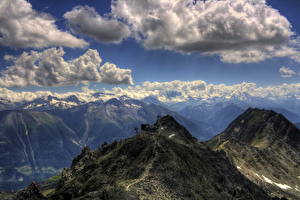 Bakgrundsbilder på skrivbordet Berg Schweiz Himmel Molnen Eggishorn Natur