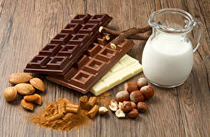 Bakgrundsbilder på skrivbordet Stilleben Nötter Mjölk Choklad Hasselnöt Chokladbar Mat