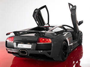 Bureaubladachtergronden Lamborghini Zwart kleur Achteraanzicht Open deur Auto